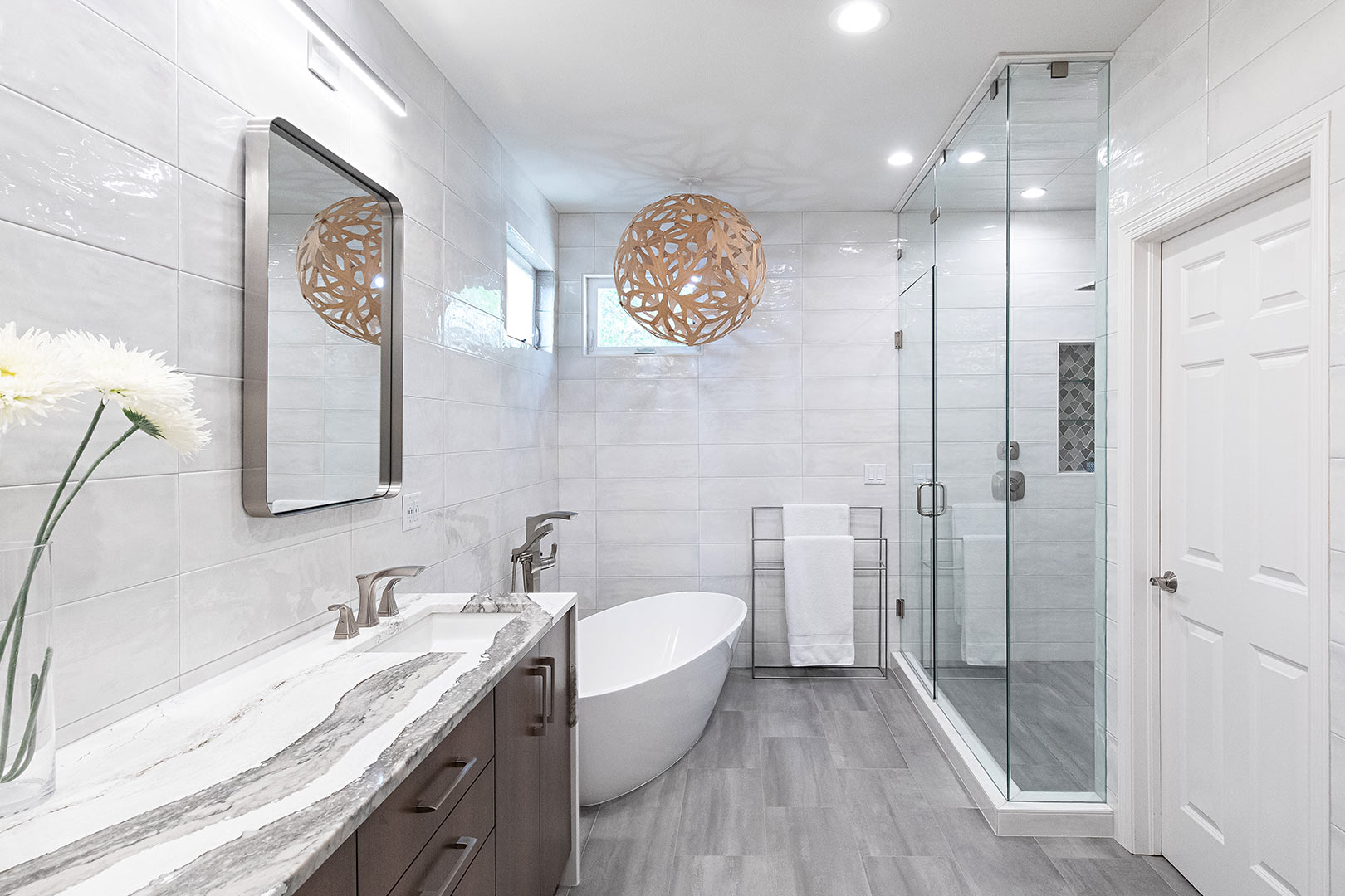 A contemporary primary bathroom renovation in fort collins colorado with floor to ceiling tile