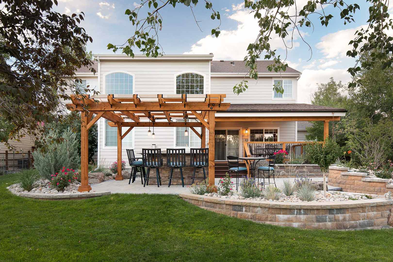 A wide angle view of the exterior of Golden current Boulevard shows the collaborative work between Freestone Design-Build and the homeowners landscape designer in Fort Collins Colorado.