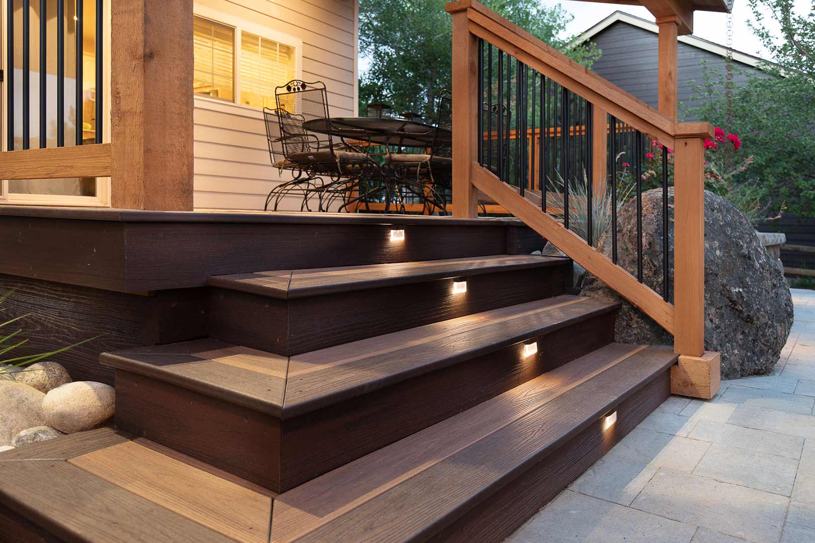 Detailed view of integrated lighting in the stair steps of the custom built cover deck of the Golden Current Boulevard project by Freestone Design-Build
