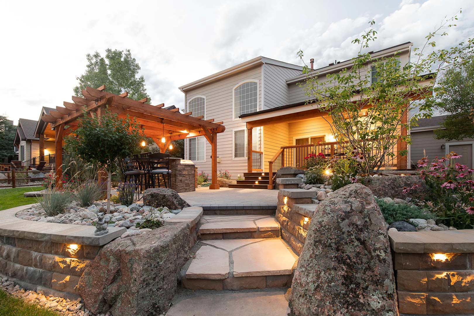 An overview image at dusk of a modern exterior design collaboration by Freestone Design-Build in Fort Collins, Colorado