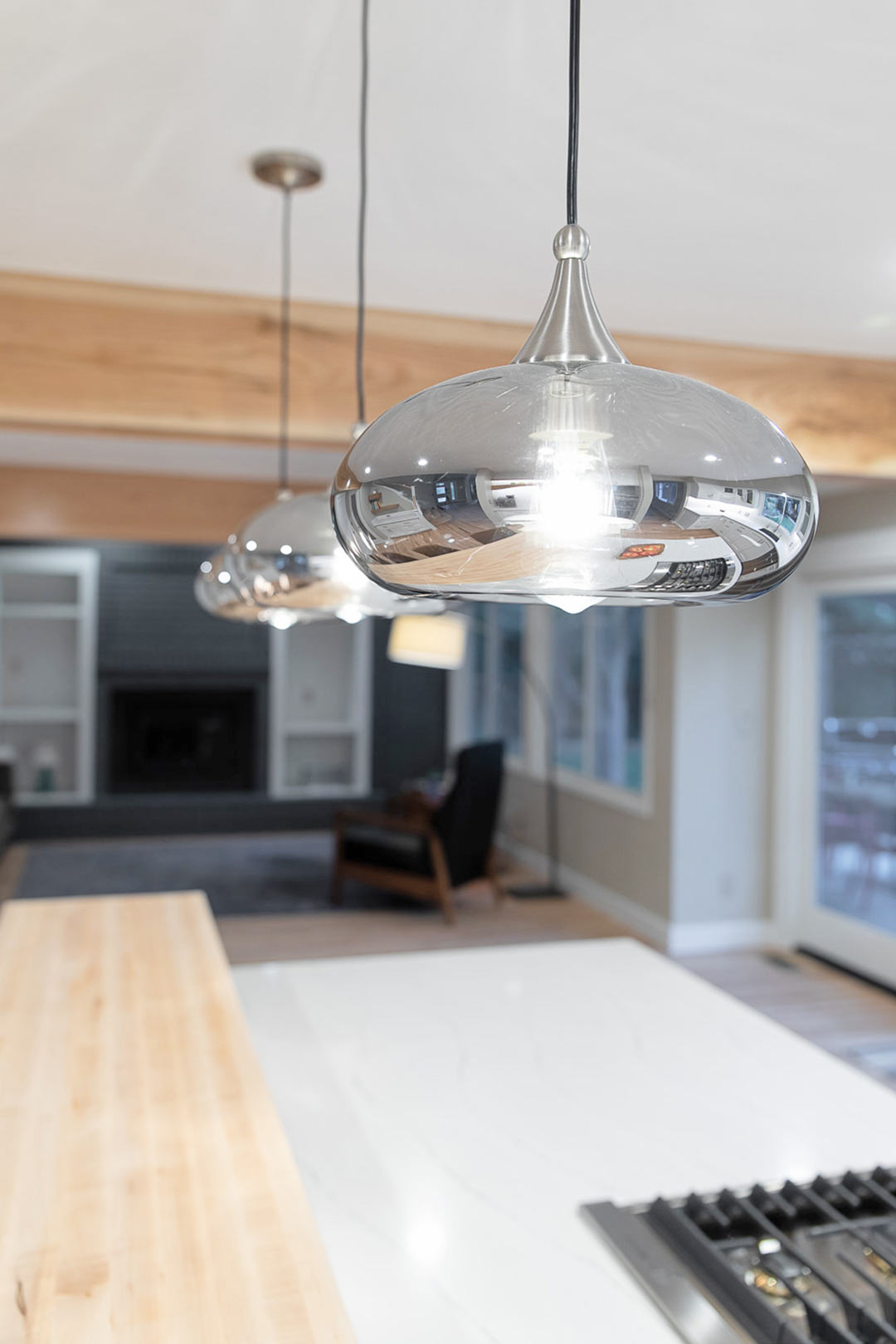 Modern light fixtures in the Shore Pine Drive kitchen renovation