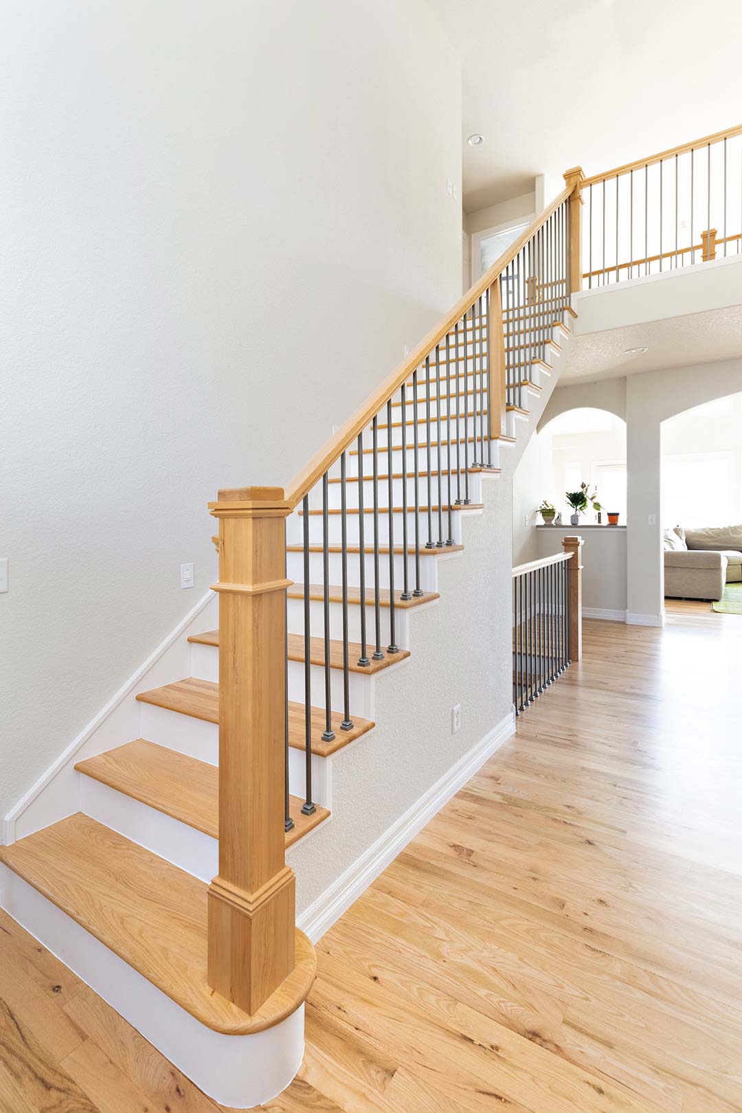A modern custom handrail and staircase that was updated by Freestone Design-Build as a part of their home renovation project of Bridget Lane in Fort Collins Colorado