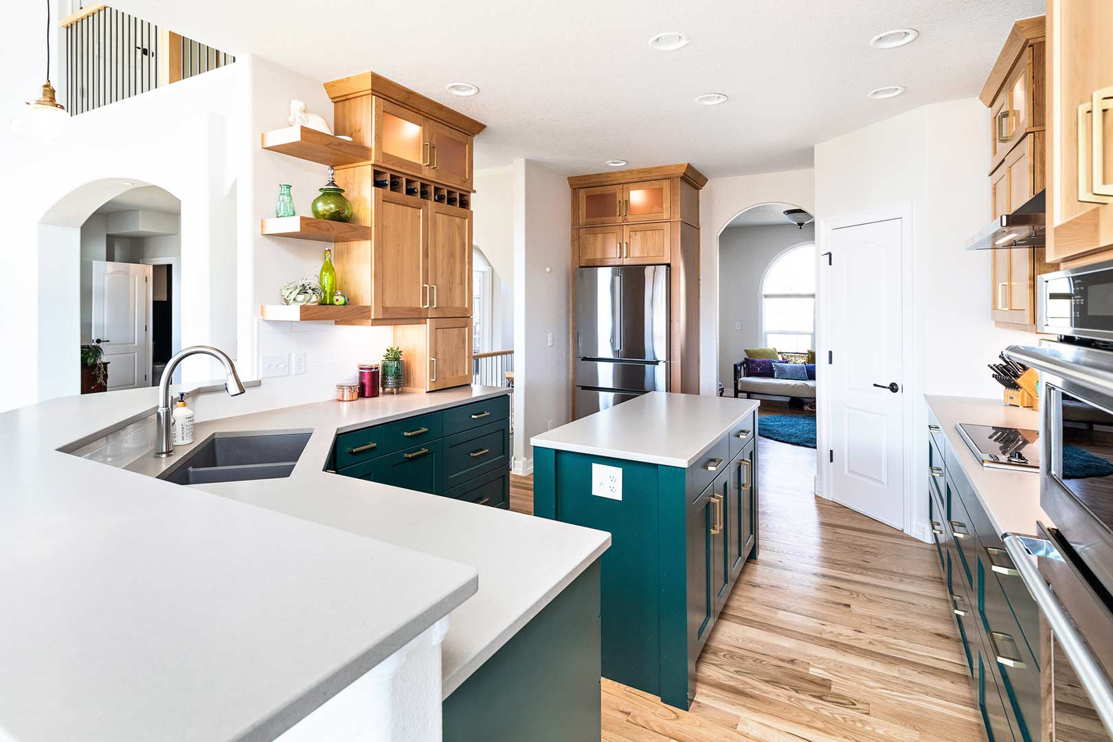 View of the modern transitional kitchen renovation that shows the massive amount of counter space and details of the kitchen cabinets designed by Freestone Design-Build.