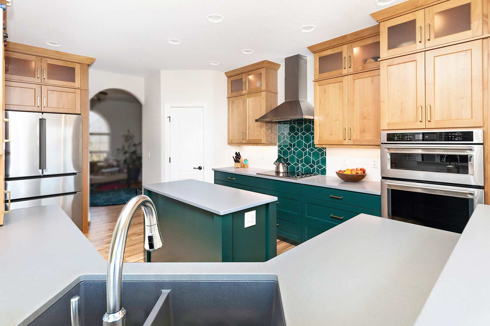 Wide angle view of the Bridget lane kitchen overlooking the modern sink and faucet into the kitchen.