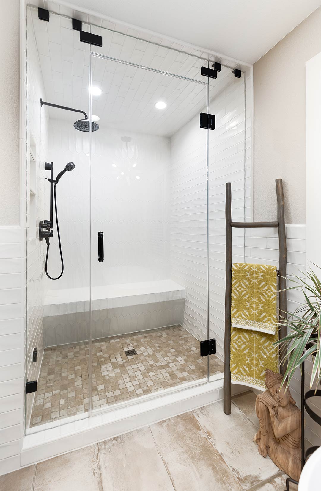 Beautiful walkin in shower tiled on every wall with a industrial farmhouse feeling.